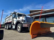 Large snowplow outside City Hall